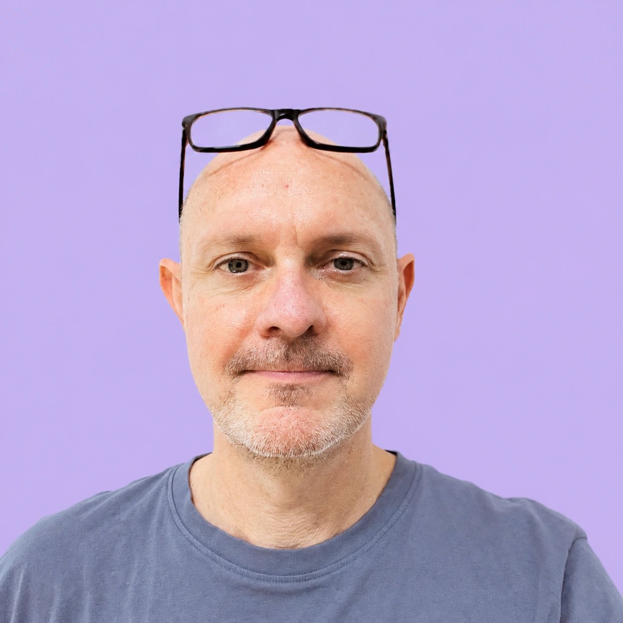 Jonathan Price on a lilac background